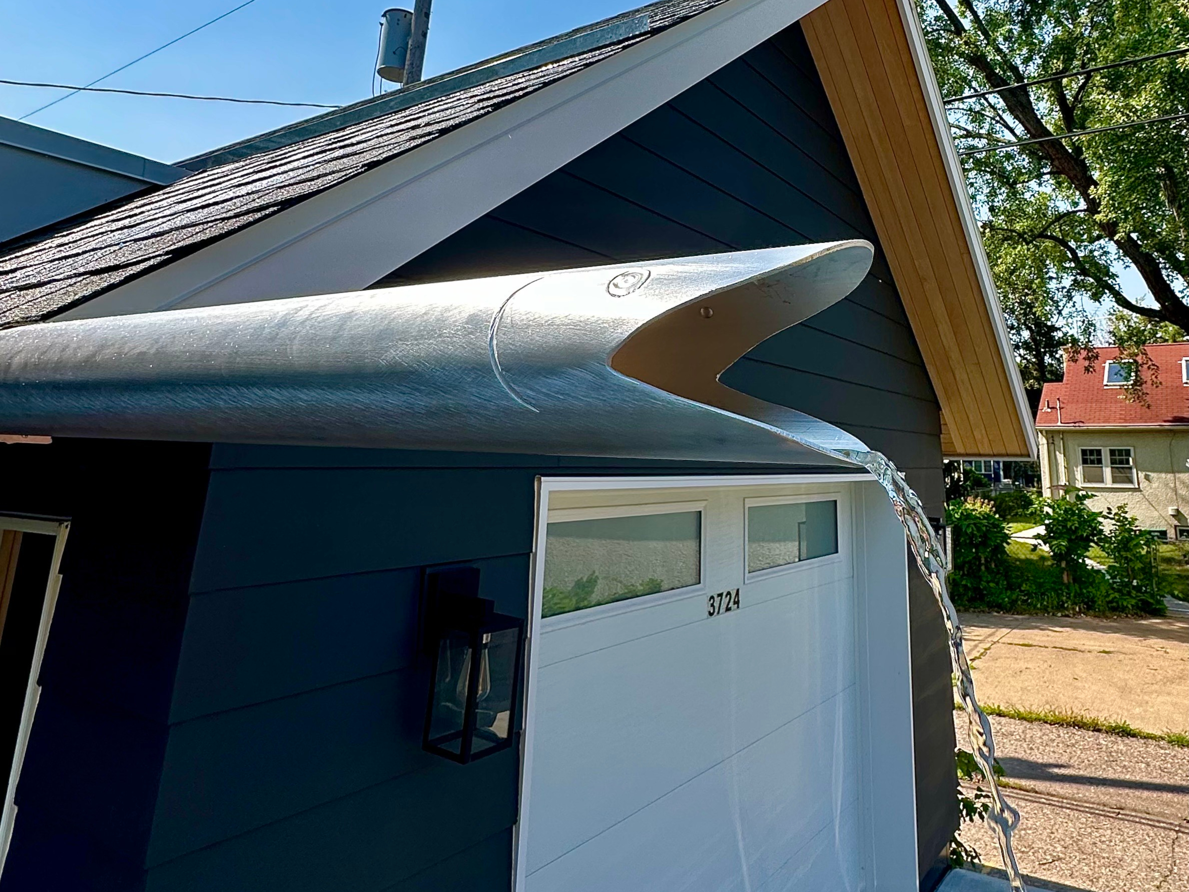 Decorative metal roof downspout